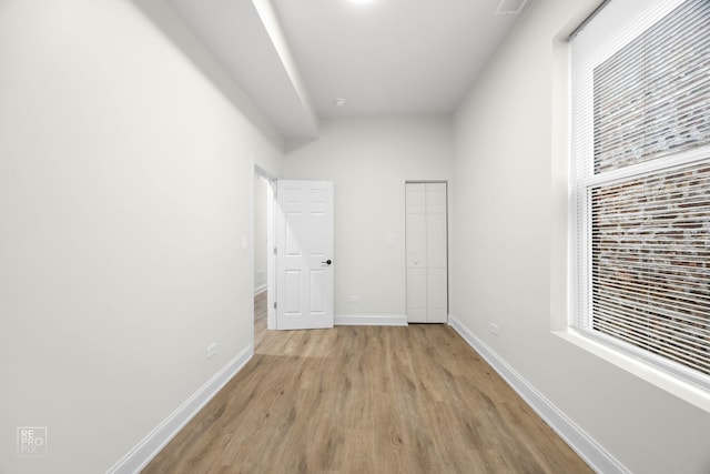 interior space with plenty of natural light and light hardwood / wood-style floors