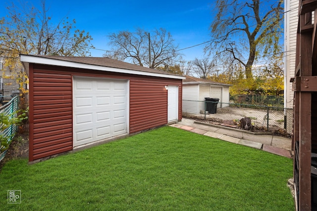 garage with a yard