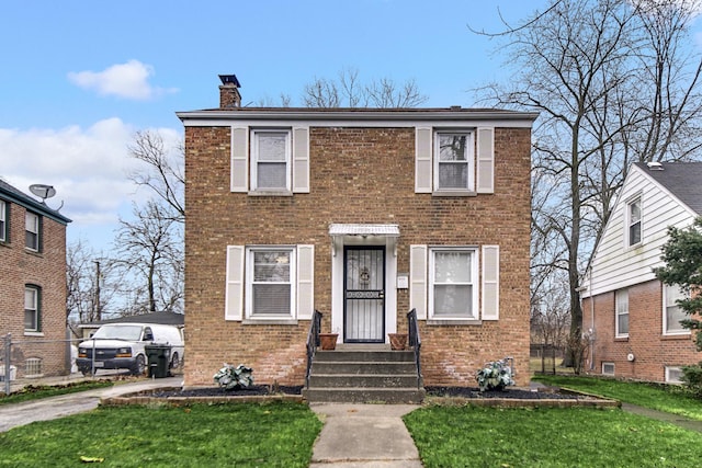 view of front of house with a front lawn