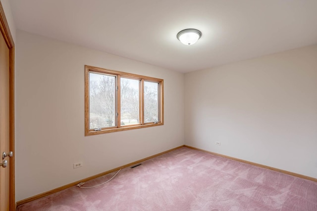 spare room with light carpet