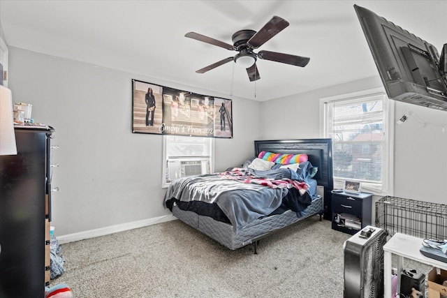 bedroom featuring carpet, ceiling fan, and cooling unit