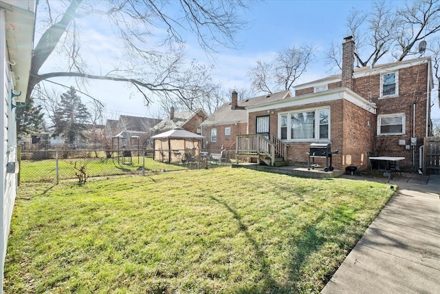 exterior space featuring a gazebo and a yard