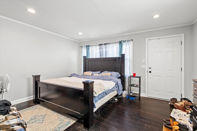 bedroom featuring dark hardwood / wood-style flooring and crown molding