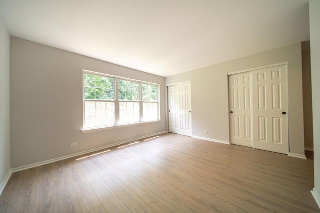 unfurnished room featuring hardwood / wood-style floors