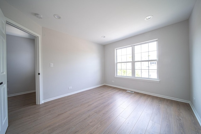 empty room featuring hardwood / wood-style flooring