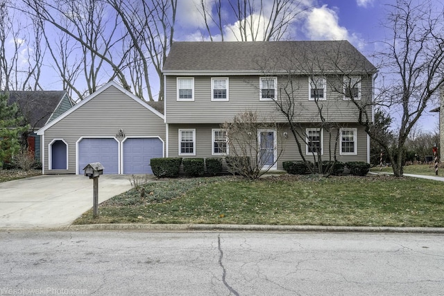 view of front of home featuring a yard and a garage