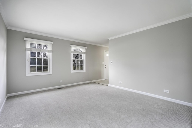 unfurnished room with light colored carpet and crown molding