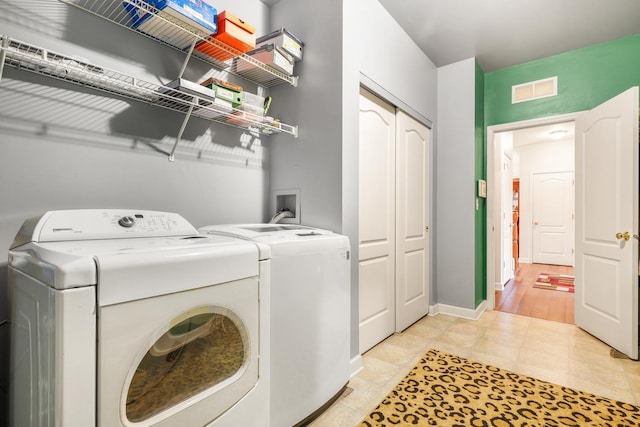 laundry room featuring washing machine and dryer