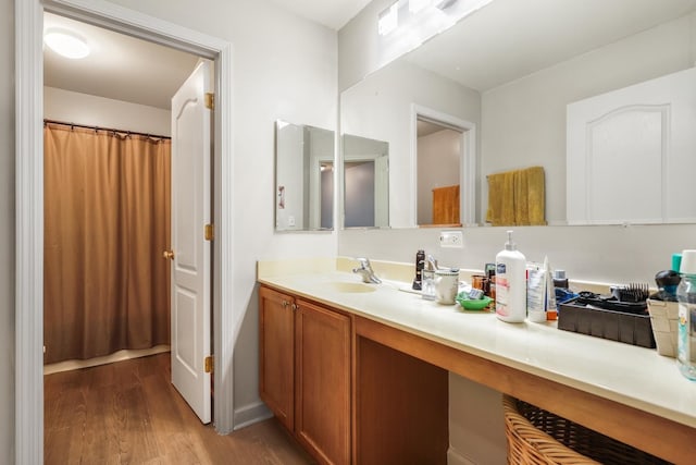 bathroom featuring vanity and hardwood / wood-style flooring