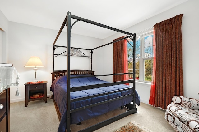 bedroom with light colored carpet