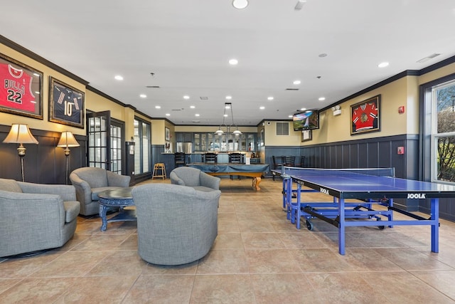 game room featuring crown molding and light tile patterned floors