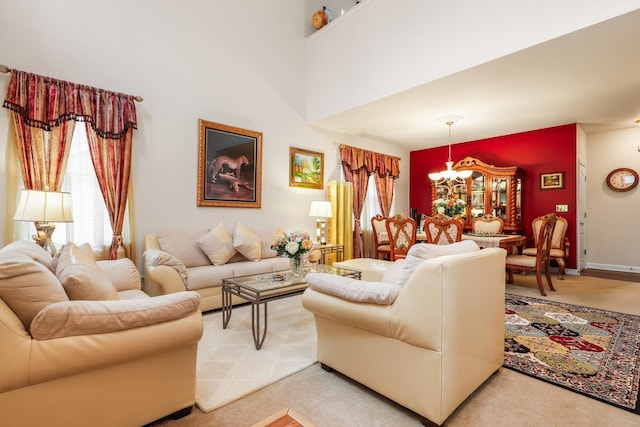 living room with carpet flooring, an inviting chandelier, and a towering ceiling