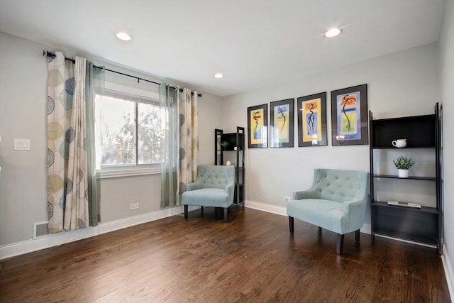 living area with dark hardwood / wood-style floors