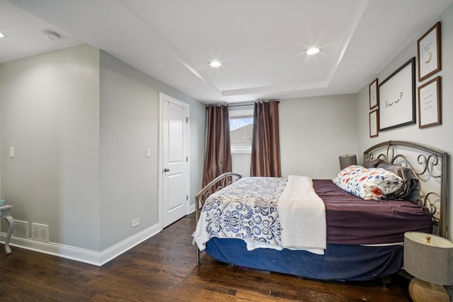 bedroom with dark wood-type flooring