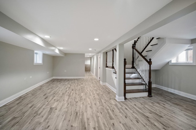 basement featuring light wood-type flooring