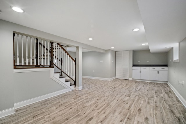 basement featuring light hardwood / wood-style flooring