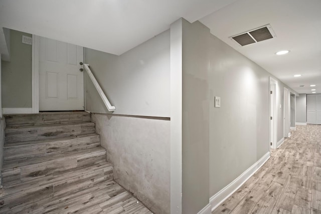 stairway with wood-type flooring