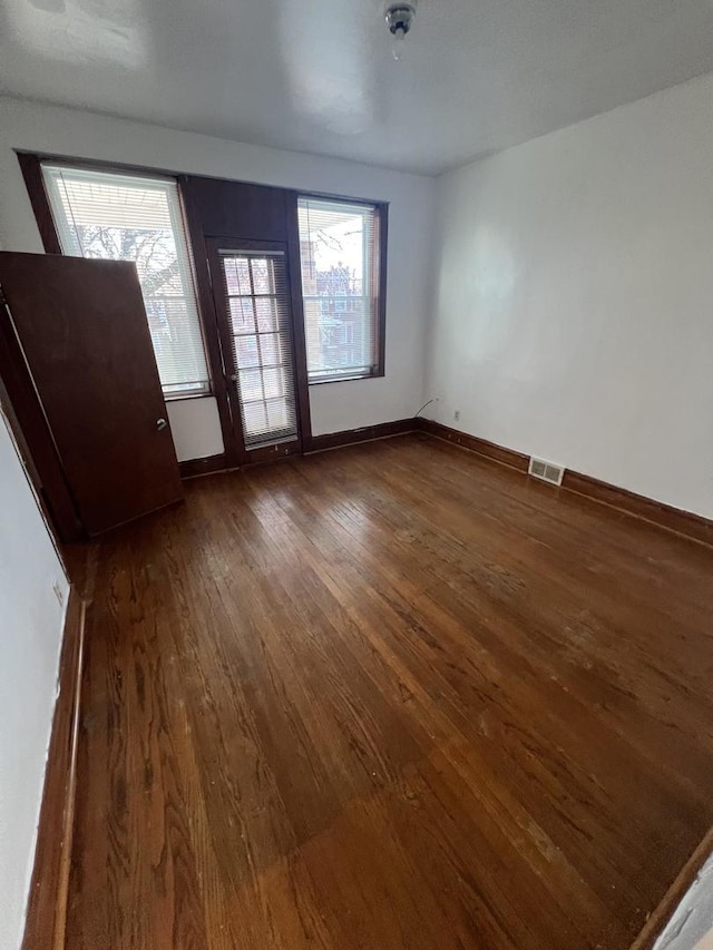 interior space featuring dark hardwood / wood-style flooring and a wealth of natural light