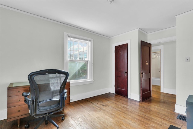 office area featuring hardwood / wood-style flooring and ornamental molding