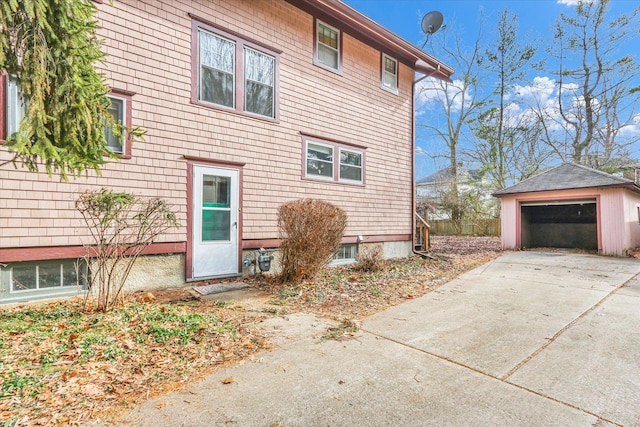 view of home's exterior featuring an outbuilding and a garage