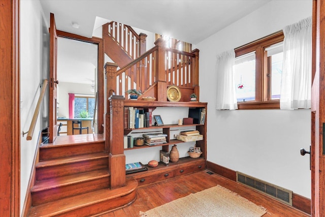 stairway featuring hardwood / wood-style flooring