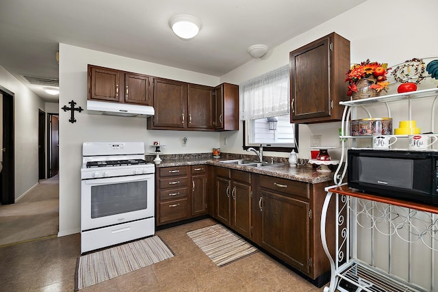 kitchen with sink, dark brown cabinetry, and white gas range oven