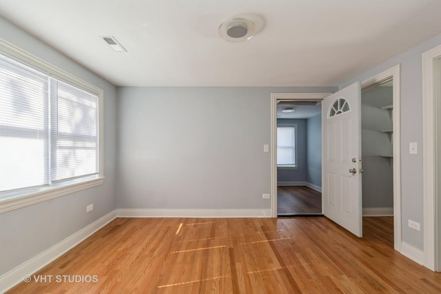 spare room with light wood-type flooring