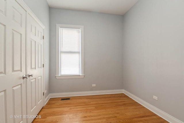 spare room with light hardwood / wood-style floors