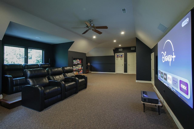 carpeted home theater featuring ceiling fan and vaulted ceiling