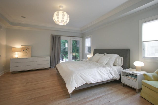 bedroom with access to outside, french doors, crown molding, and light hardwood / wood-style flooring