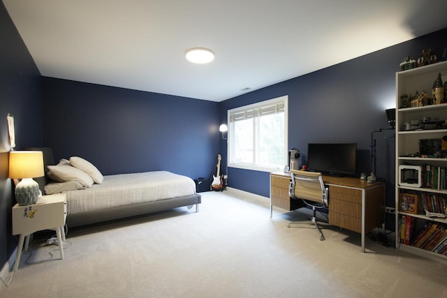 bedroom featuring light colored carpet