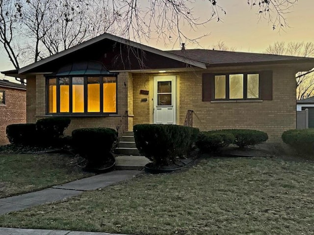 10016 Minnick Ave, Oak Lawn, IL 60453 - view of front of house featuring brick siding and a front lawn