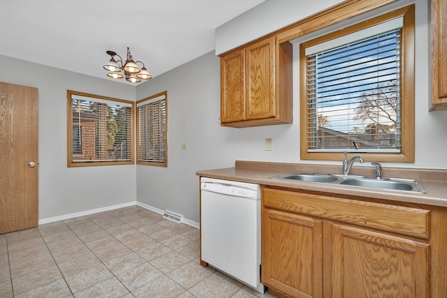 10016 Minnick Ave, Oak Lawn, IL 60453 - kitchen with dishwasher, a chandelier, light tile patterned floors, light countertops, and brown cabinetry