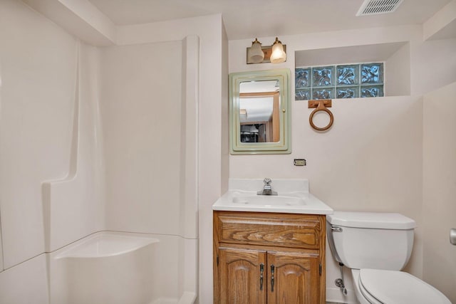 bathroom with vanity and toilet