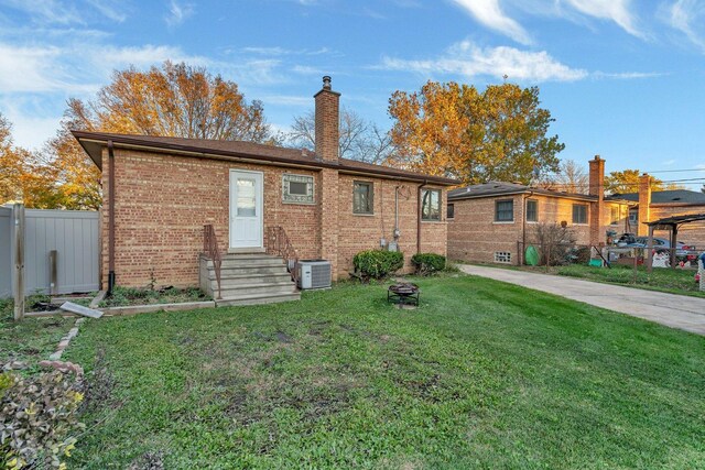 10016 Minnick Ave, Oak Lawn, IL 60453 - rear view of house with brick siding, a chimney, and entry steps