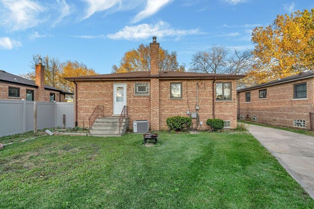 10016 Minnick Ave, Oak Lawn, IL 60453 - rear view of property featuring a chimney and brick siding