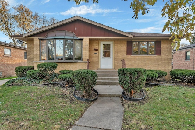 10016 Minnick Ave, Oak Lawn, IL 60453 - view of front of property with brick siding and a front yard