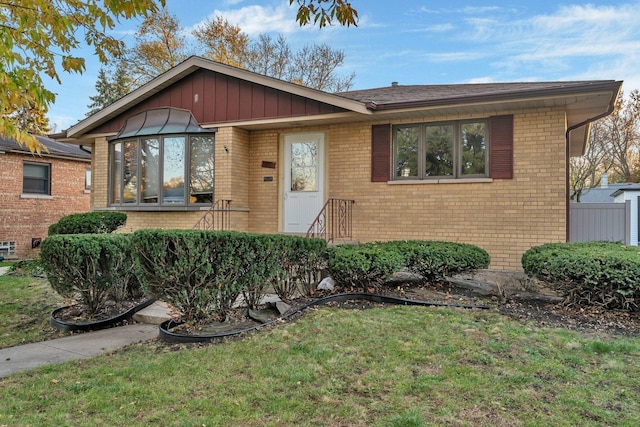 10016 Minnick Ave, Oak Lawn, IL 60453 - view of front facade with brick siding and a front yard