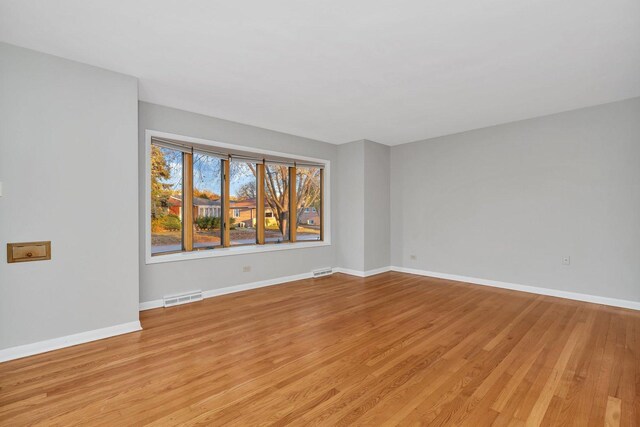 10016 Minnick Ave, Oak Lawn, IL 60453 - empty room featuring light wood-style flooring and baseboards
