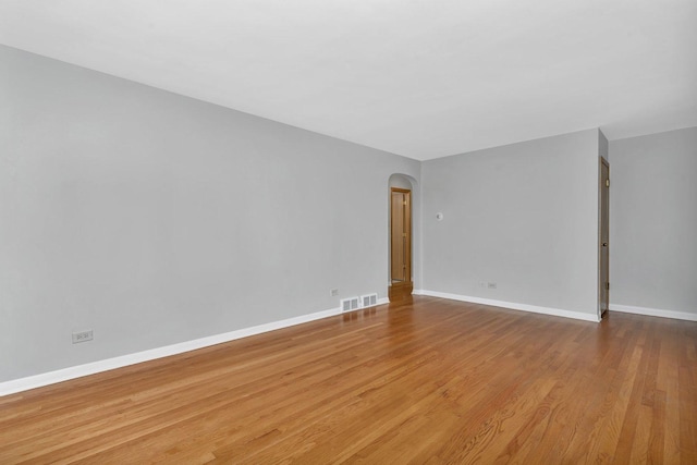 10016 Minnick Ave, Oak Lawn, IL 60453 - spare room with arched walkways and wood finished floors