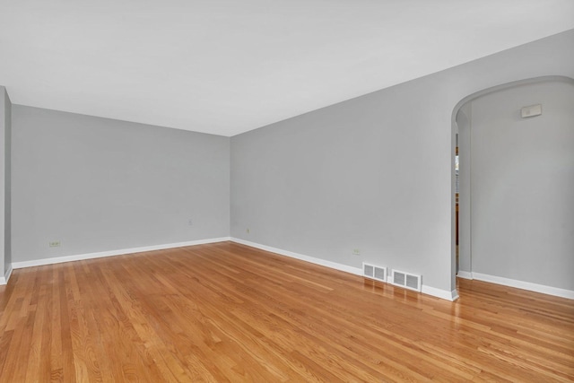 10016 Minnick Ave, Oak Lawn, IL 60453 - unfurnished room featuring arched walkways and light wood-style flooring