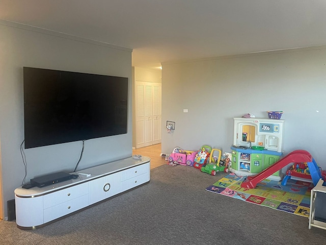 game room with carpet flooring and crown molding