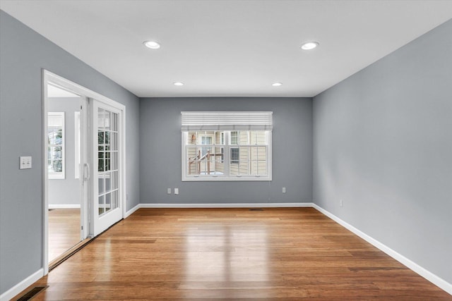 spare room featuring light hardwood / wood-style floors