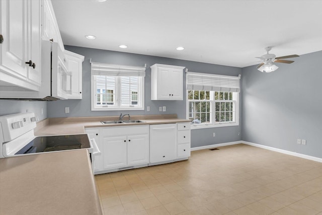 kitchen featuring white cabinets, ceiling fan, white appliances, and sink