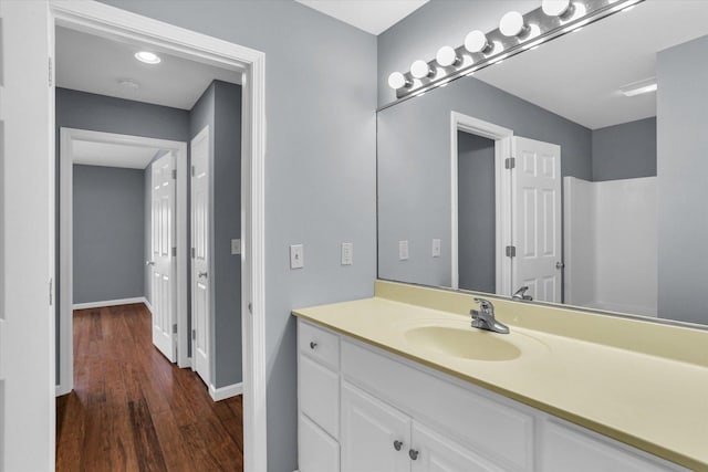 bathroom with vanity and hardwood / wood-style flooring