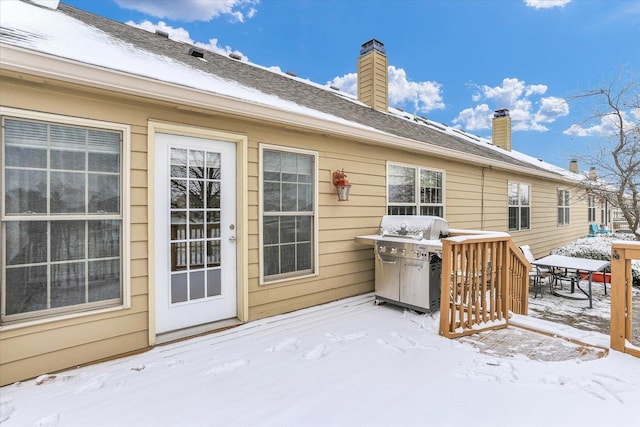 snow covered deck with grilling area