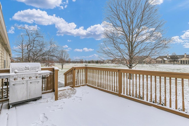 snow covered deck with area for grilling