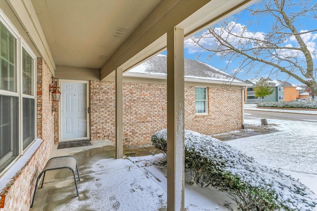 view of snow covered patio