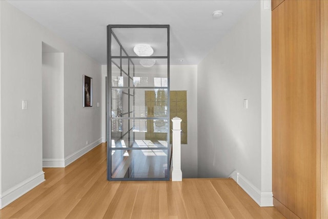 doorway with hardwood / wood-style flooring