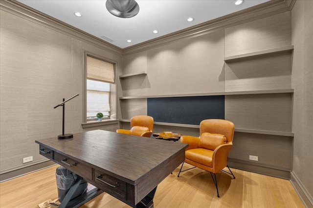 office space with crown molding and light wood-type flooring